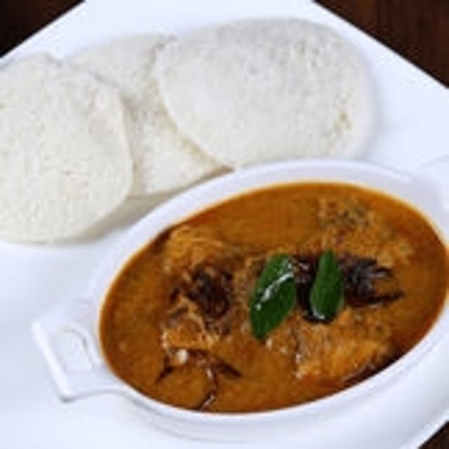Idli with Chicken Kulambu (Gravy).